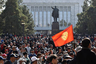 People attend a rally to demand the resignation of Kyrgyzstan's President Sooronbai Jeenbekov in Bishkek