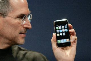 Apple Chief Executive Officer Steve Jobs holds new iPhone in San Francisco