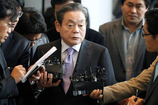 FILE PHOTO: Samsung Electronics chairman Lee Kun-hee answers reporters' questions upon his arrival at the company's headquarters in Seoul