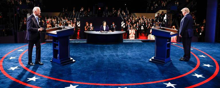 Presidente dos EUA, Donald Trump, e o candidato democrata e ex-vice presidente, Joe Biden, em debate