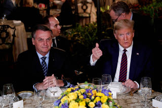 FILE PHOTO: FILE PHOTO: U.S. President Donald Trump participates in a working dinner with Brazilian President Jair Bolsonaro at the Mar-a-Lago resort in Palm Beach, Florida