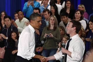 U.S. President Barack Obama shakes hands with Facebook CEO Mark Zuckerberg after a town-hall meeting at Facebook headquarters in Palo Alto