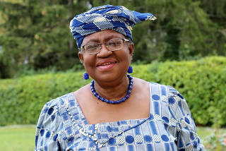FILE PHOTO: Okonjo-Iweala poses outside a Nigerian diplomatic residence in Chambesy