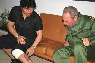 FILE PHOTO: Argentine legend Maradona meeting with Fidel Castro