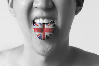 Great Britain flag painted in tongue of a man - indicating English and British language and speaking in Black and White tone