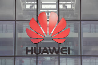 FILE PHOTO: Huawei logo is pictured on the headquarters building in Reading