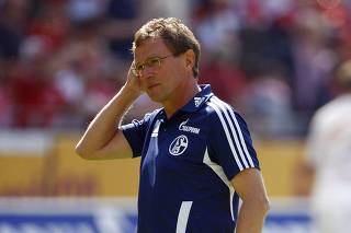 Schalke's coach Rangnick stands on the pitch before their German Bundesliga soccer match against Mainz in Mainz