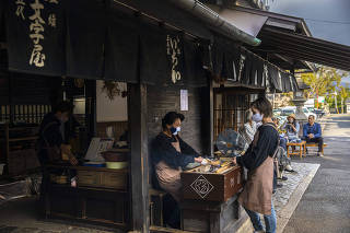 Ichiwa, which has been selling grilled rice flour cakes to travelers for a thousand years, in Kyoto, Japan, Oct. 23, 2020. (Hiroko Masuike/The New York Times)