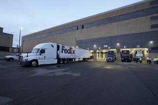 A FedEx truck sits in the dock at the Pfizer Global Supply manufacturing plant in Portage