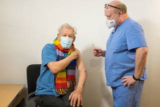 Actor Ian McKellen receives COVID-19 vaccine at Queen Mary University Hospital, in London