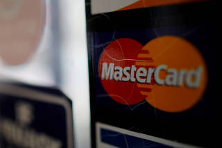 FILE PHOTO: A sticker shows that a store accepts MasterCard in Harvard Square in Cambridge