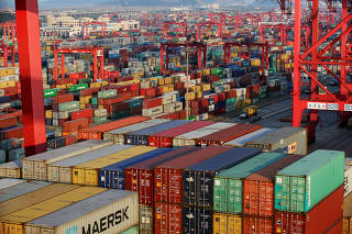 FILE PHOTO: Container boxes are seen at the Yangshan Deep Water Port, part of the Shanghai Free Trade Zone, in Shanghai