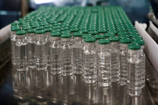 FILE PHOTO: Vials of AstraZeneca's COVISHIELD, coronavirus disease (COVID-19) vaccine are seen before they are packaged inside a lab at Serum Institute of India, in Pune