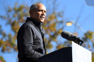 FILE PHOTO: Former President Barack Obama addresses voters one day before the election, in Atlanta, Georgia