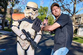 Jason Satterlund poses with a Stormtrooper in Los Angeles, Dec. 30, 2020. (Michelle Groskopf/The New York Times)
