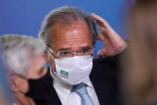 Brazil's Economy Minister Paulo Guedes reacts before a ceremony at the Planalto Palace