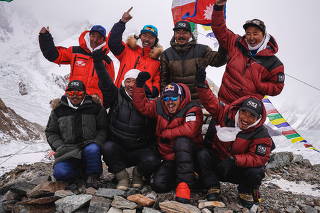 Team of climbers from Nepal is seen during the Puja ceremony