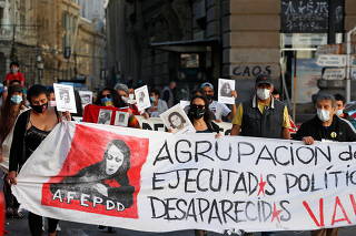Demonstrators attend a rally to mark the international Human Rights day in Valparaiso