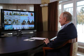 Russian President Putin attends a meeting with university students via a video conference call in Zavidovo