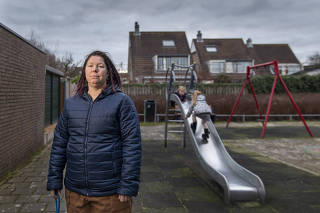 Vanessa van Ewijk and her two children in Lisserbroek, the Netherlands, Jan. 15, 2021. (Ilvy Njiokiktjien/The New York Times)