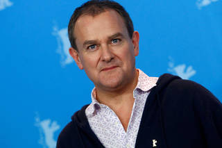 FILE PHOTO: Actor Hugh Bonneville poses during a photocall to promote the movie 'Viceroy' s House' at the 67th Berlinale International Film Festival in Berlin