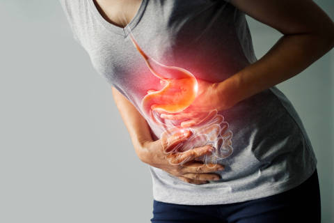 Woman touching stomach painful suffering from stomachache causes of menstruation period, gastric ulcer, appendicitis or gastrointestinal system desease. Healthcare and health insurance concept