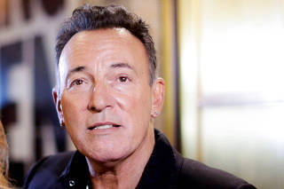 FILE PHOTO: Singer Bruce Springsteen exits the theatre after attending the Broadway debut of 