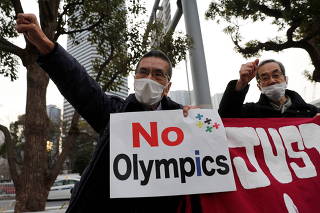 Protesters hold a rally to demand a cancellation of the 2020 Tokyo Olympic Games in Tokyo
