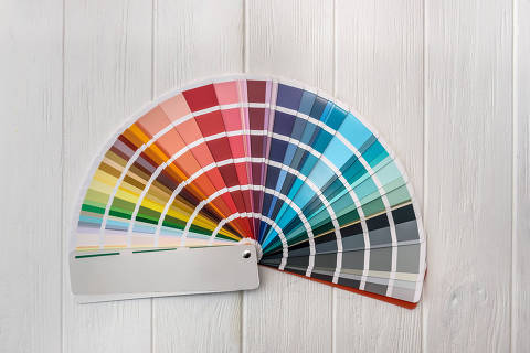 Colorful palette for wall painting on wooden desk