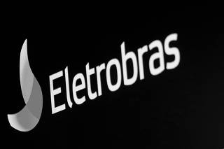 FILE PHOTO: The logo for Eletrobras, a Brazilian electric utilities company, is displayed on a screen on the floor at the NYSE in New York
