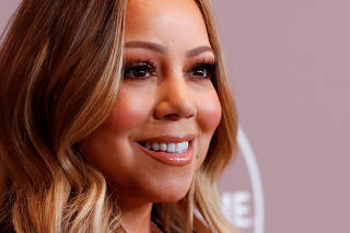 FILE PHOTO: Mariah Carey's brother files lawsuit over memoir