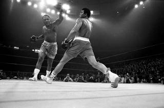 Joe Frazier, left, in a boxing match against Muhammad Ali at Madison Square Garden in New York.