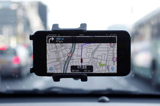 FILE PHOTO: Waze, a mobile satellite navigation application, is seen on a smartphone in this photo illustration taken in Tel Aviv