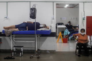 COVID-19 patients are cared for in an area that was improvised to accommodate more patients at the public HRAN Hospital in Brasilia