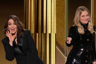 Hosts Tina Fey and Amy Poehler are seen in this handout screen grab from the 78th Annual Golden Globe Awards in Beverly Hills