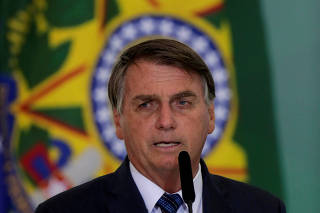 FILE PHOTO: FILE PHOTO: FILE PHOTO: Brazil's President Jair Bolsonaro speaks during a ceremony to launch a program to help new mayors, at Planalto Palace in Brasilia