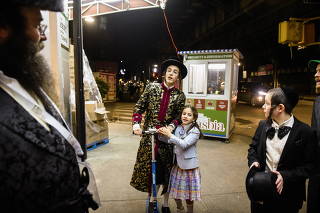People celebrate the Jewish holiday of Purim in New York