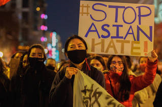 Protesters gather in the Chinantown neighborhood of Washington on Wednesday, March 17, 2021, after eight people were shot to death at three massage parlors in the Atlanta area on Tuesday evening. (Shuran Huang/The New York Times)