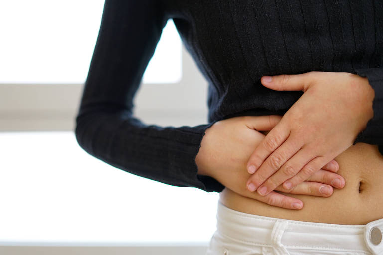 Woman touching her belly with appendicitis pain. Appendicitis concept.