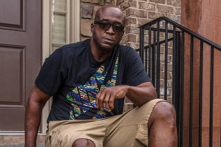 Former NFL player Kevin Henry outside his home in Lawrenceville, Ga., Aug. 22, 2020. (Matthew Odom/The New York Times)