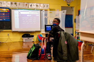 A student at an elementary school in Burlington, N.J., on Monday, March 15, 2021.  (Anna Moneymaker/The New York Times)