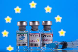 Picture illustration of vials with Pfizer-BioNTech, AstraZeneca, and Moderna coronavirus disease (COVID-19) vaccine labels with an EU flag