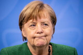 German Chancellor Angela Merkel attends a news conference after discussing COVID-19 lockdown extension with state premiers