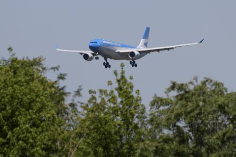 An Aerolineas Argentinas plane carrying 300,000 doses of the Sputnik V vaccine against COVID-19, arrives at Ezeiza international airport in Buenos Aires outskirts on December 24, 2020. - Argentina's health ministry said Wednesday it has given the controversial Russian Sputnik V coronavirus vaccine 