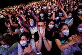 People attend first massive concert since the beginning of COVID-19 pandemic in Barcelona