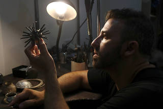 Argentine artist Marcelo Toledo works on art pieces for the 