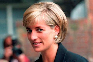 FILE PHOTO: Princess Diana arrives at the Royal Geographical Society in London