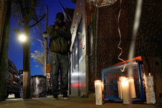 A fan takes part in a vigil for musician and actor DMX outside White Plains Hospital in White Plains, New York