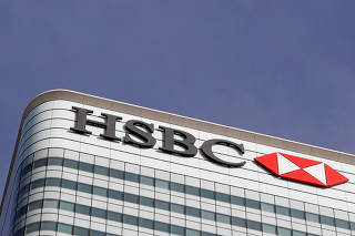 FILE PHOTO: FILE PHOTO - The HSBC bank logo is seen at their offices in the Canary Wharf financial district in London