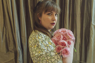 In a photo made remotely, Lena Dunham, wearing one of her designs from a new collaboration with 11 Honoré, in England, March 28, 2021. (Devin Oktar Yalkin/The New York Times)